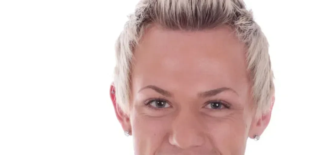 Handsome young man with a fresh, hip hairstyle on a white background