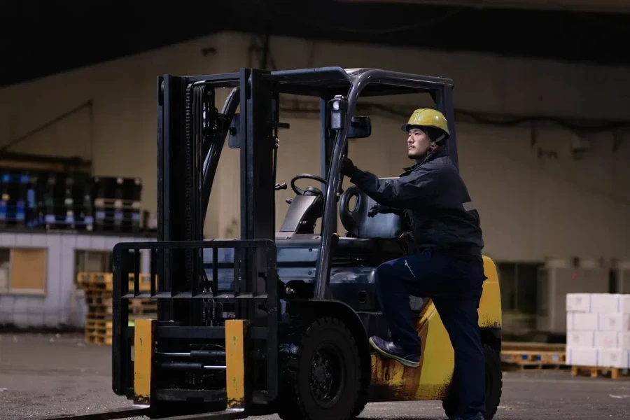 Japanese man operating a forklift