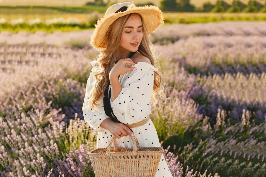 Lady wearing a straw hat and polka dot dress