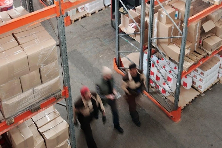 Men inspecting goods in a warehouse