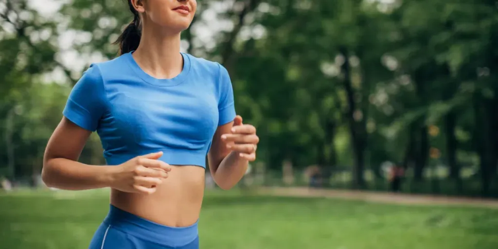 One young fit woman jogging in the park, sports lifestyle