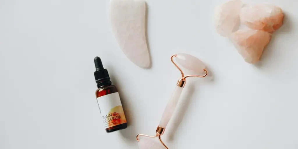 Rose quartz face roller and guasha with Vitamin C oil