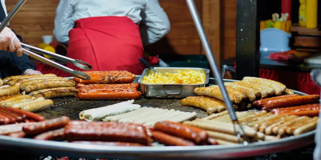 Street food at the main city fair Kebab, corn, grilled sausages