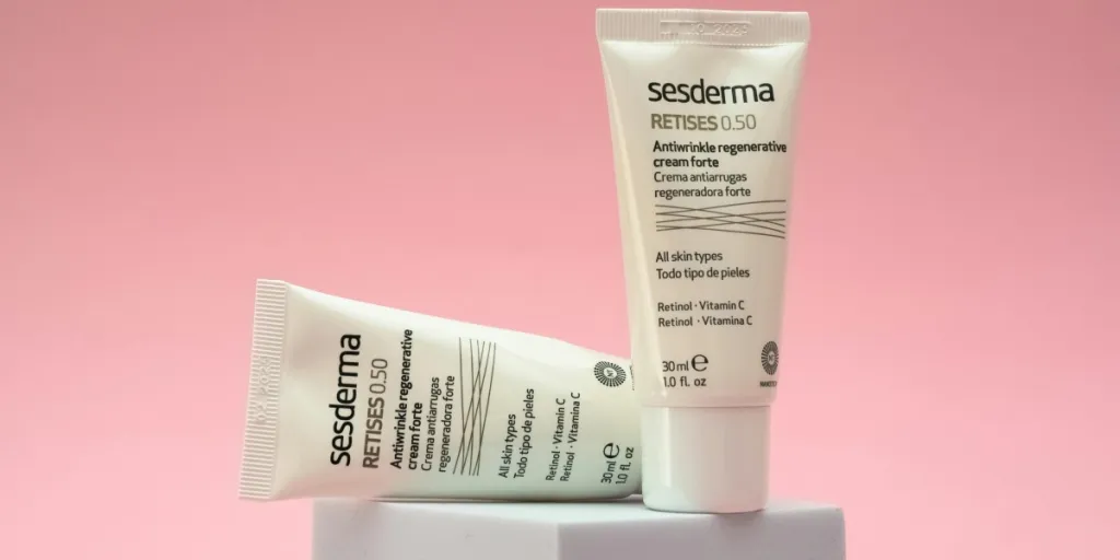 Two Sesderma Retises 0.50 skincare tubes displayed on a pink background, highlighting anti-aging cream