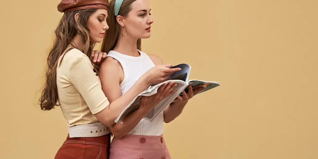 Young beautiful girls dressed in retro vintage style enjoying the old european city summertime lifestyle