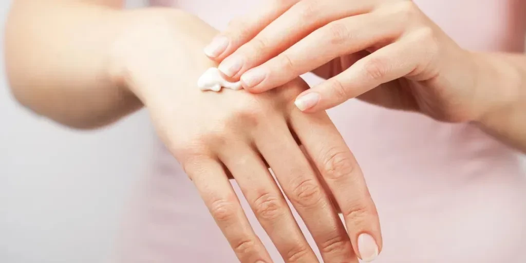 beautiful woman hands with cream