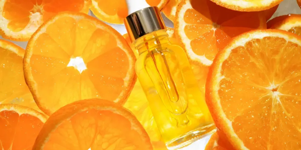 facial serum in a glass bottle with vitamin C