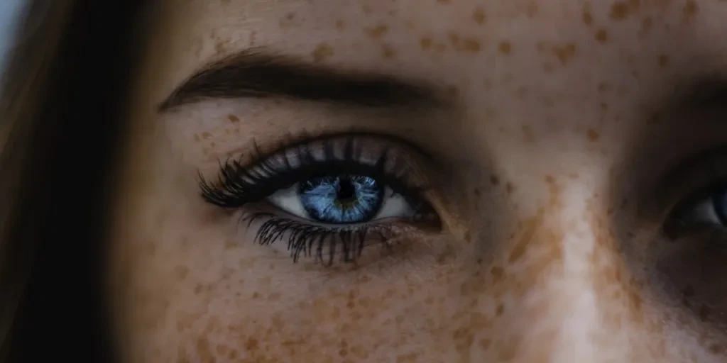 woman with freckles and spider lashes