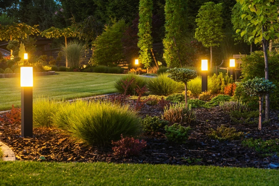 A garden with yellow bug lights