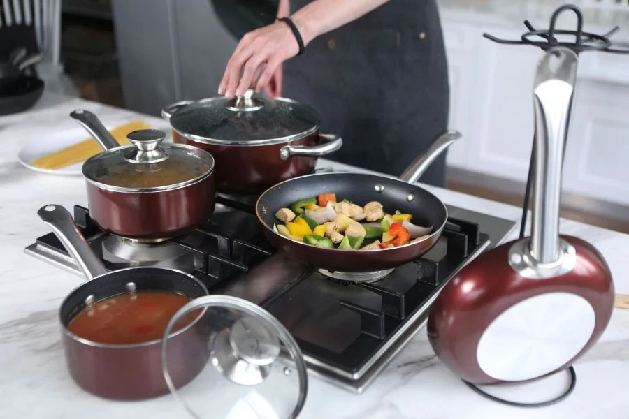 A person cooking using a gas stove