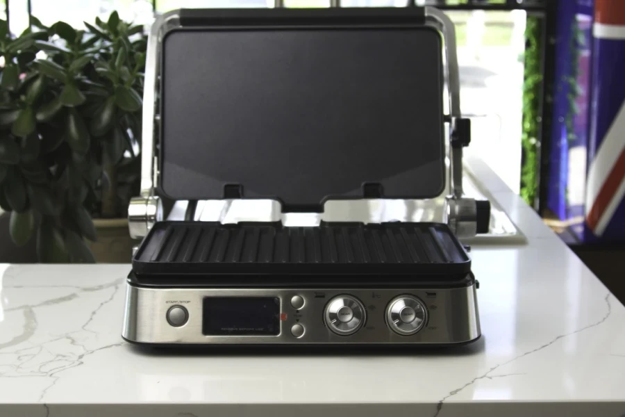 A smart electric grill on a polished table