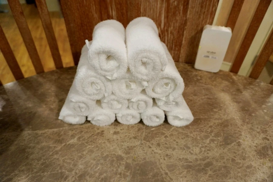 A stack of towels on a marble surface