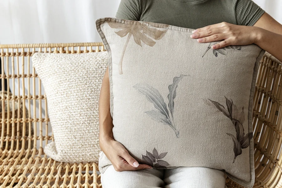 Beige pillow featuring trending patterns with leaves