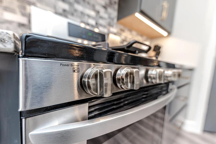 Close-up of stove knobs in a modern kitchen