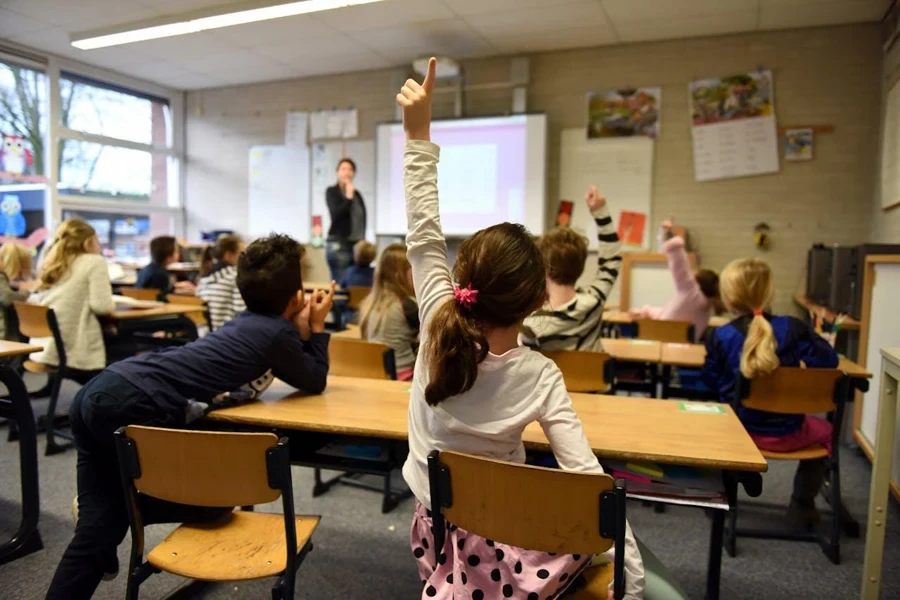 Instructor using projector screen in an educational institution