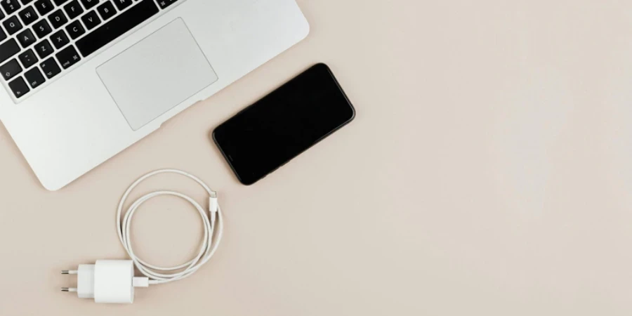 Laptop, Smart Phone and Charge on Table