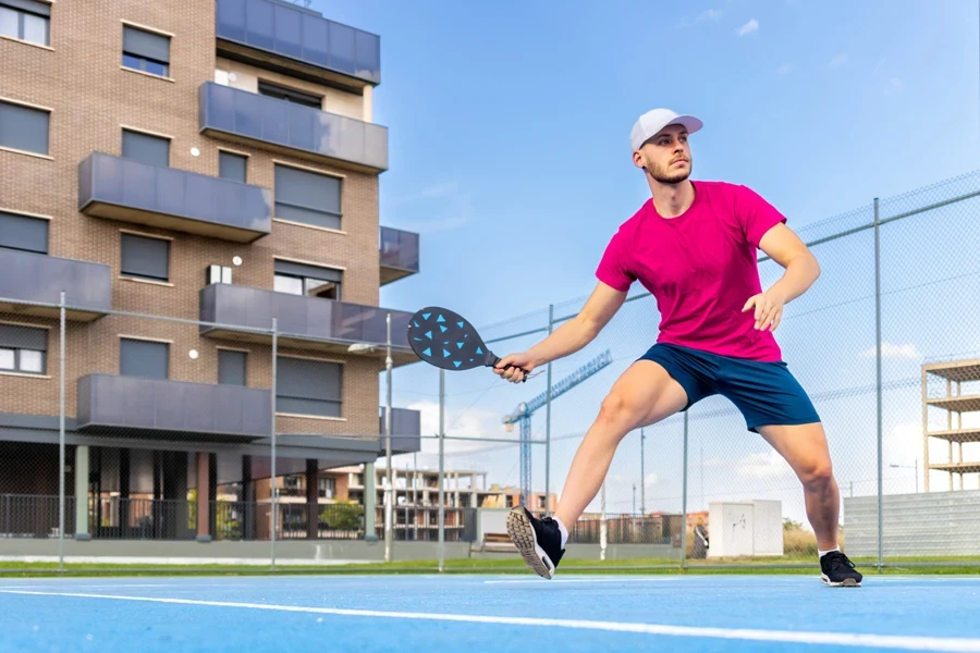 Man wearing cushioned pickleball socks during swinging motion