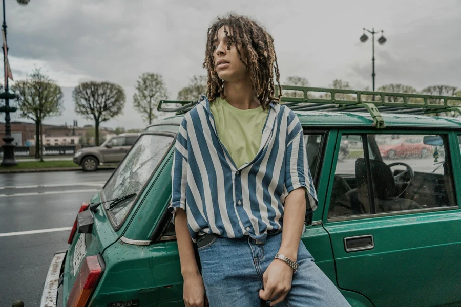 Photo of Man Leaning on Vehicle