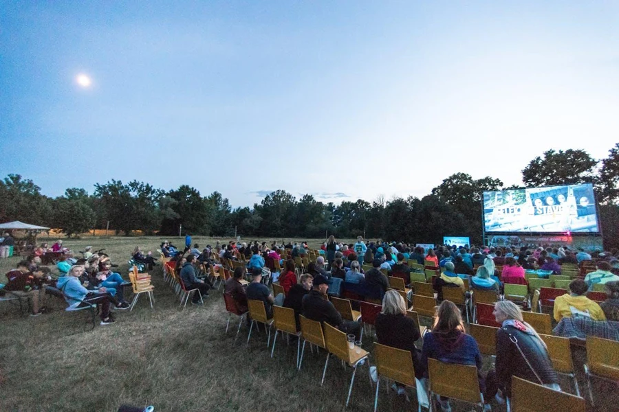 Projector screen being used at an outdoor event