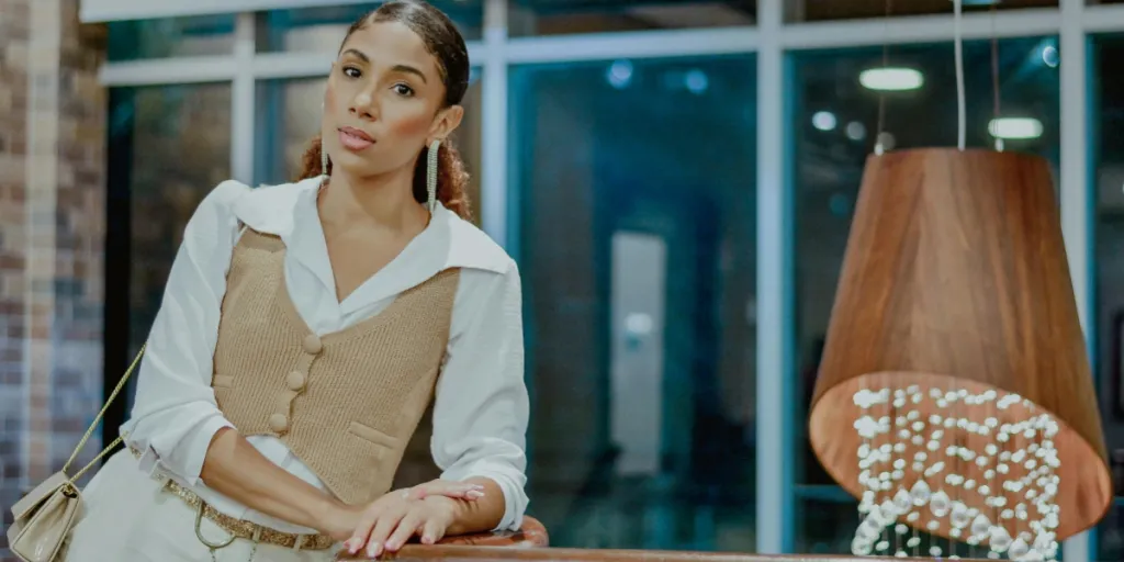 Woman posing in a beige corduroy vest