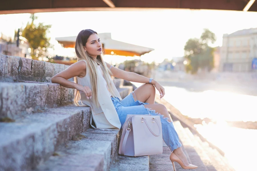 Woman rocking distressed loose jeans