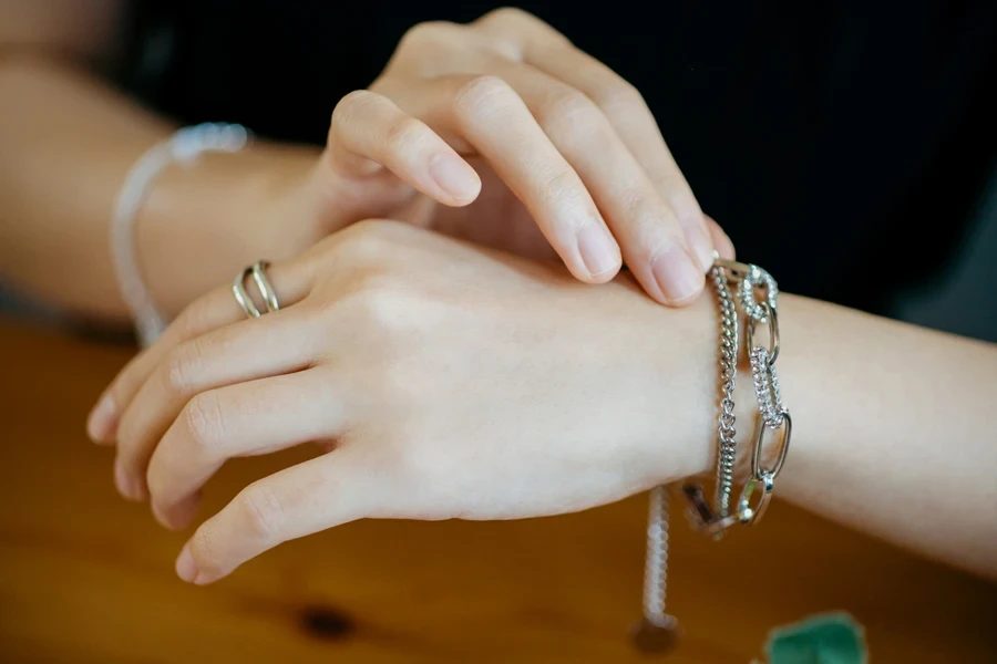 Woman showing off luxurious silver bracelet