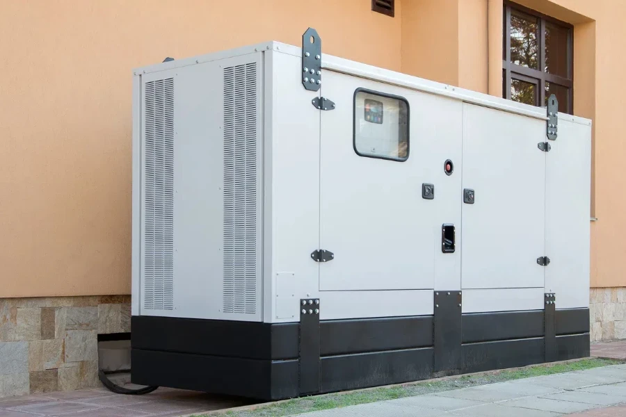 A diesel generator near a building with a control panel