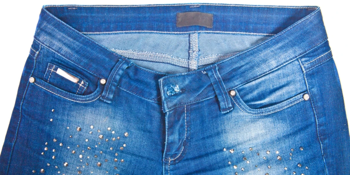 a picture of a blue jeans with rhinestones on it