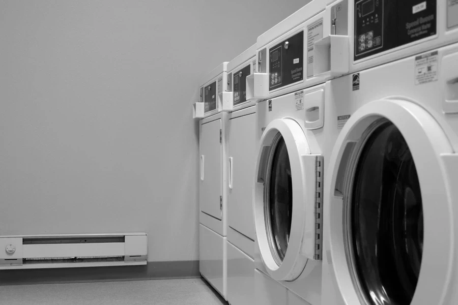 commercial washers and dryers in black and white