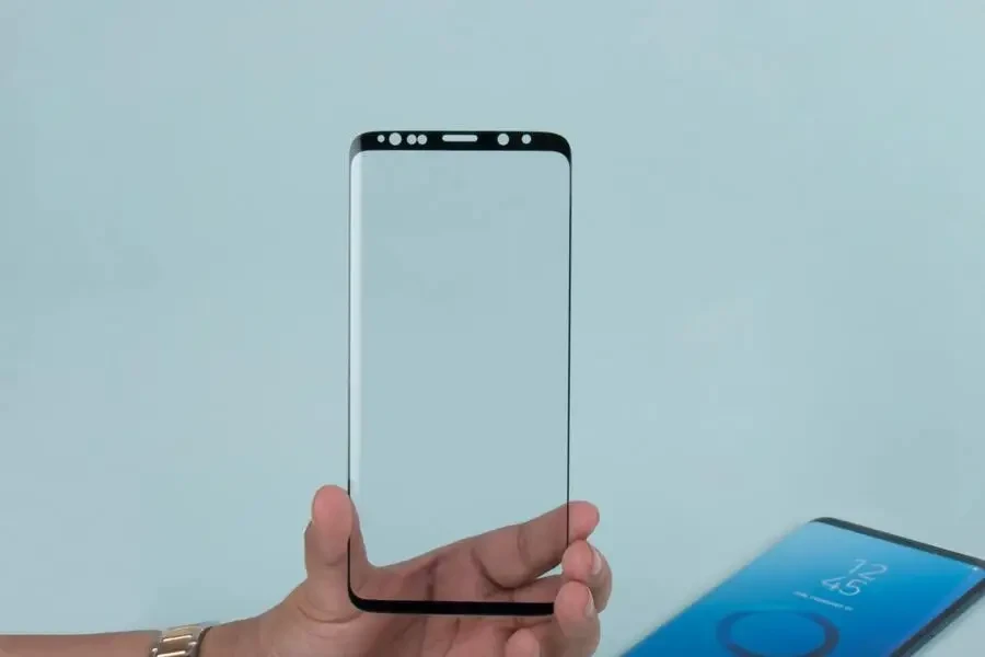 hands holding tampered glass screen protector