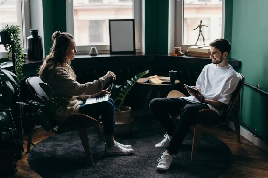 Man and woman sitting and talking