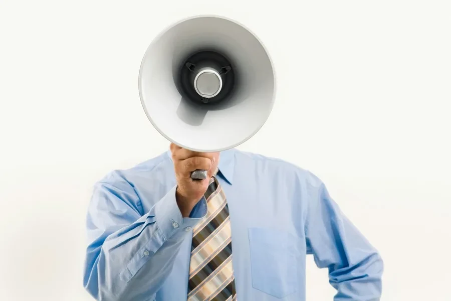 Man holding a large megaphone