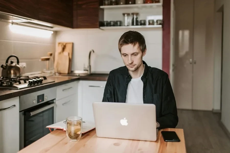 Man working on laptop at home