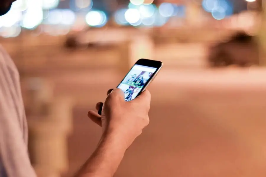 photo of a person scrolling a smartphone