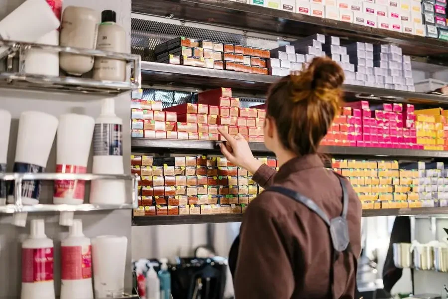 woman selecting products on a shelf