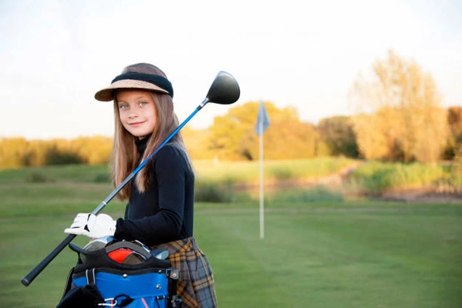 A Beautiful Young Girl Playing Golf at Her Local Golf Course