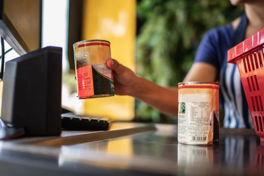 A cashier scanning UPC at checkout