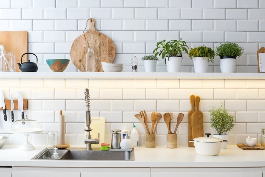 A kitchen with a rhythmic brick wall design