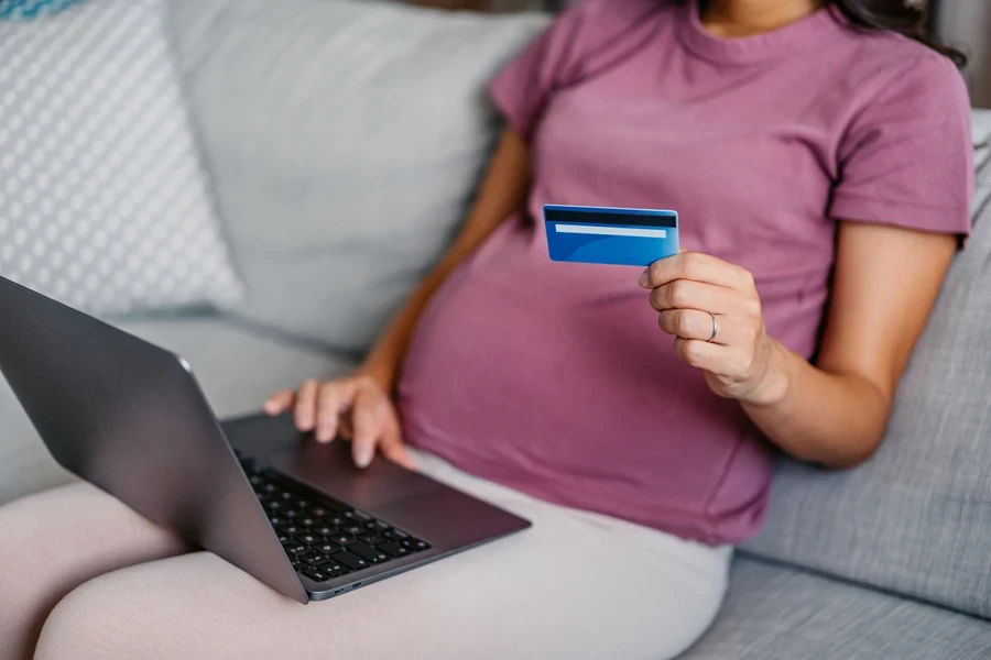 A pregnant woman pre-ordering in her living room