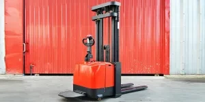 A red electric stacker in a warehouse