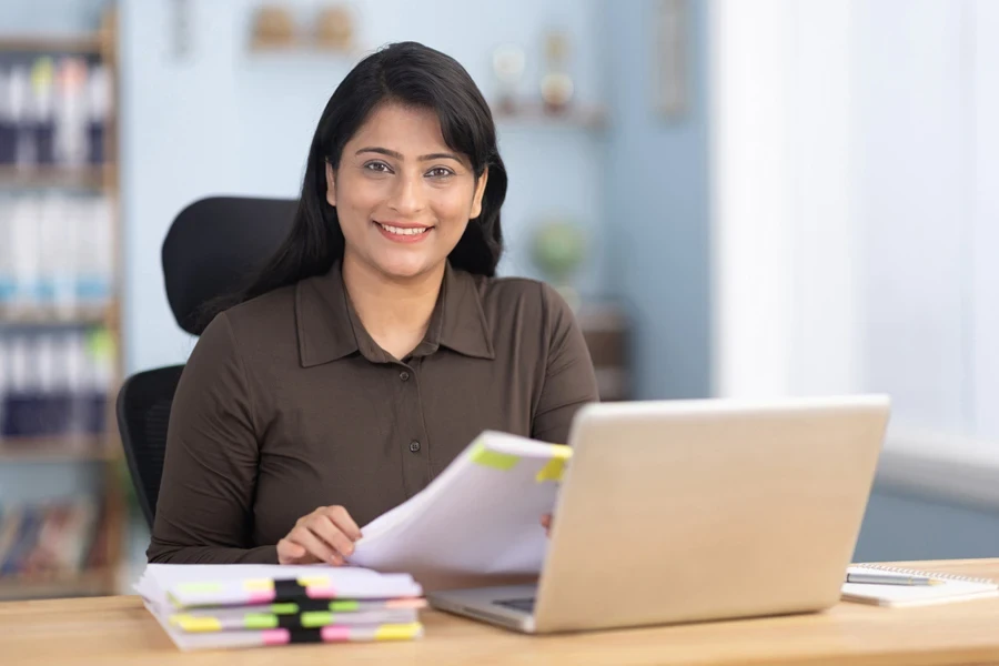 A writer in front of a laptop