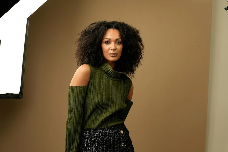 Beautiful Woman in Green Sweater Posing in Studio