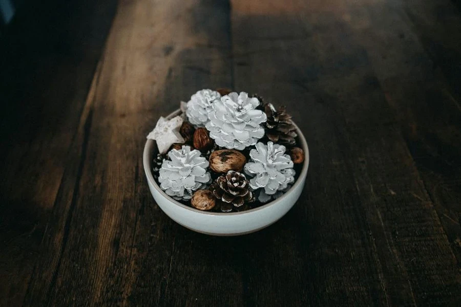 Bowl of decorative autumn pine cones