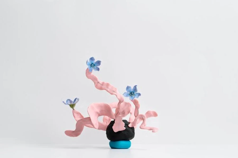 Decorative abstract clay sculpture with flowers