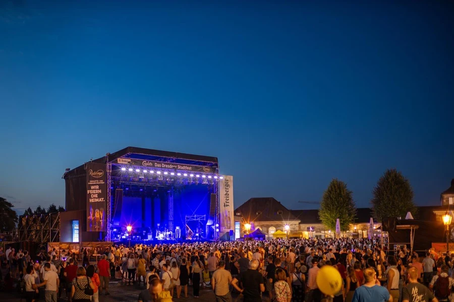 Dresden, Event stage and crowd at the Canaletto city festival. Live music events in the old town attract a lot of people. Theaterplatz square is an event location.