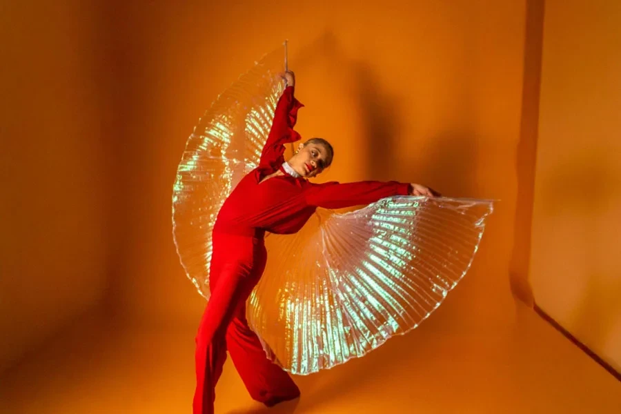 Elegant Latina Dancer in Red with Angel Wings