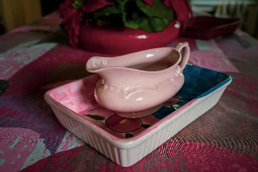 Hand painted porcelain gravy boat and saucer