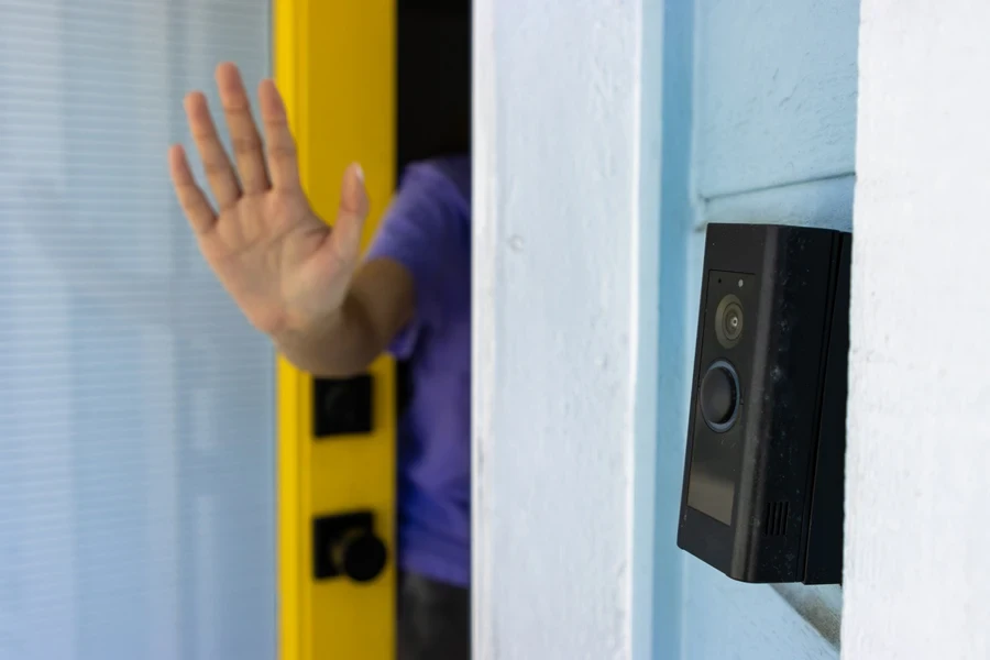 Hand waving in front of AI doorbell