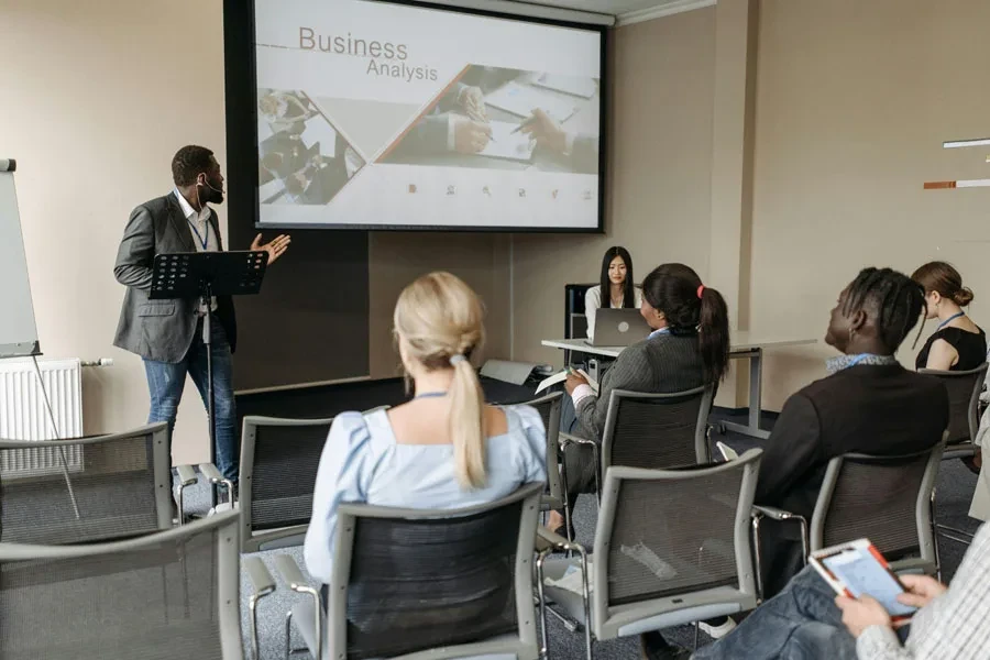 Man in Black Blazer Having a Presentation