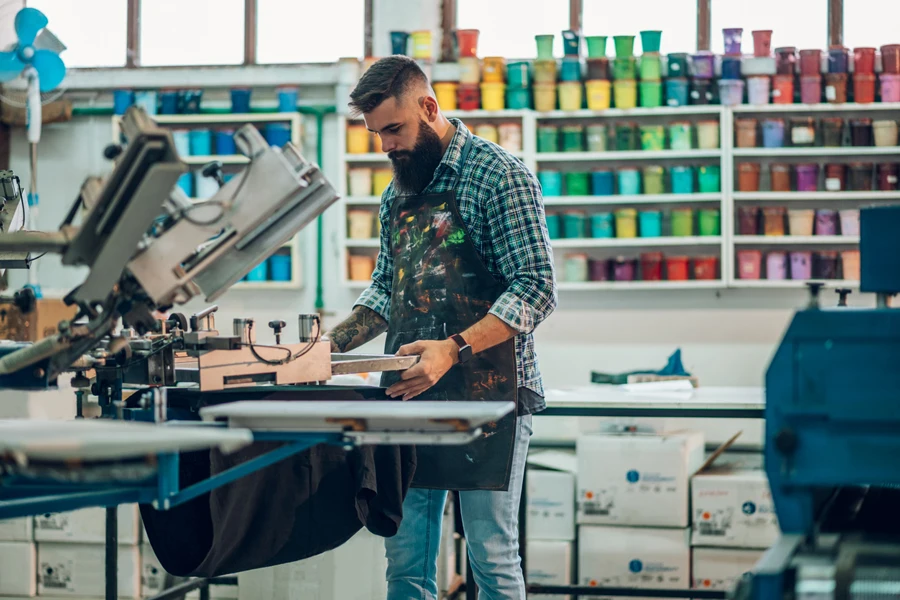 Man working on a printing machine